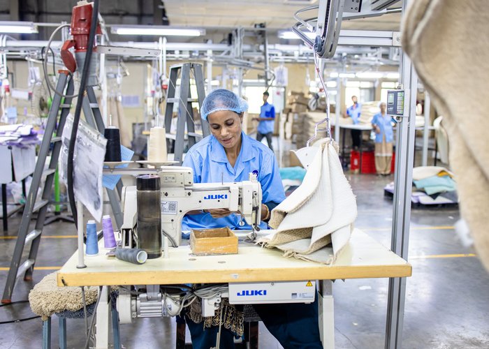 Shaoxing Fabrics production line — precision stitching and finishing